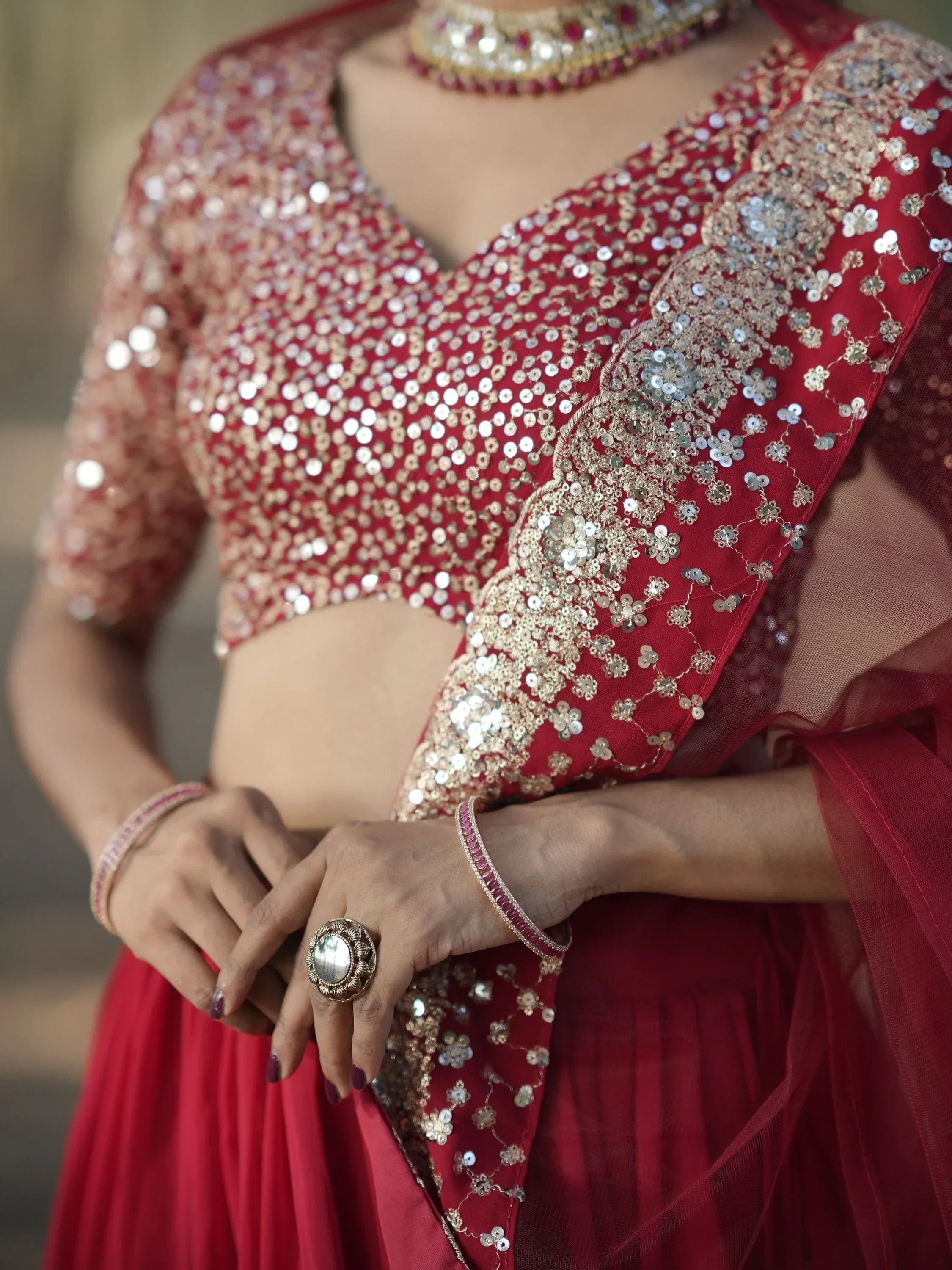 Red sequin lehenga choli with floral embroidery, perfect for Indian weddings and festive occasions
