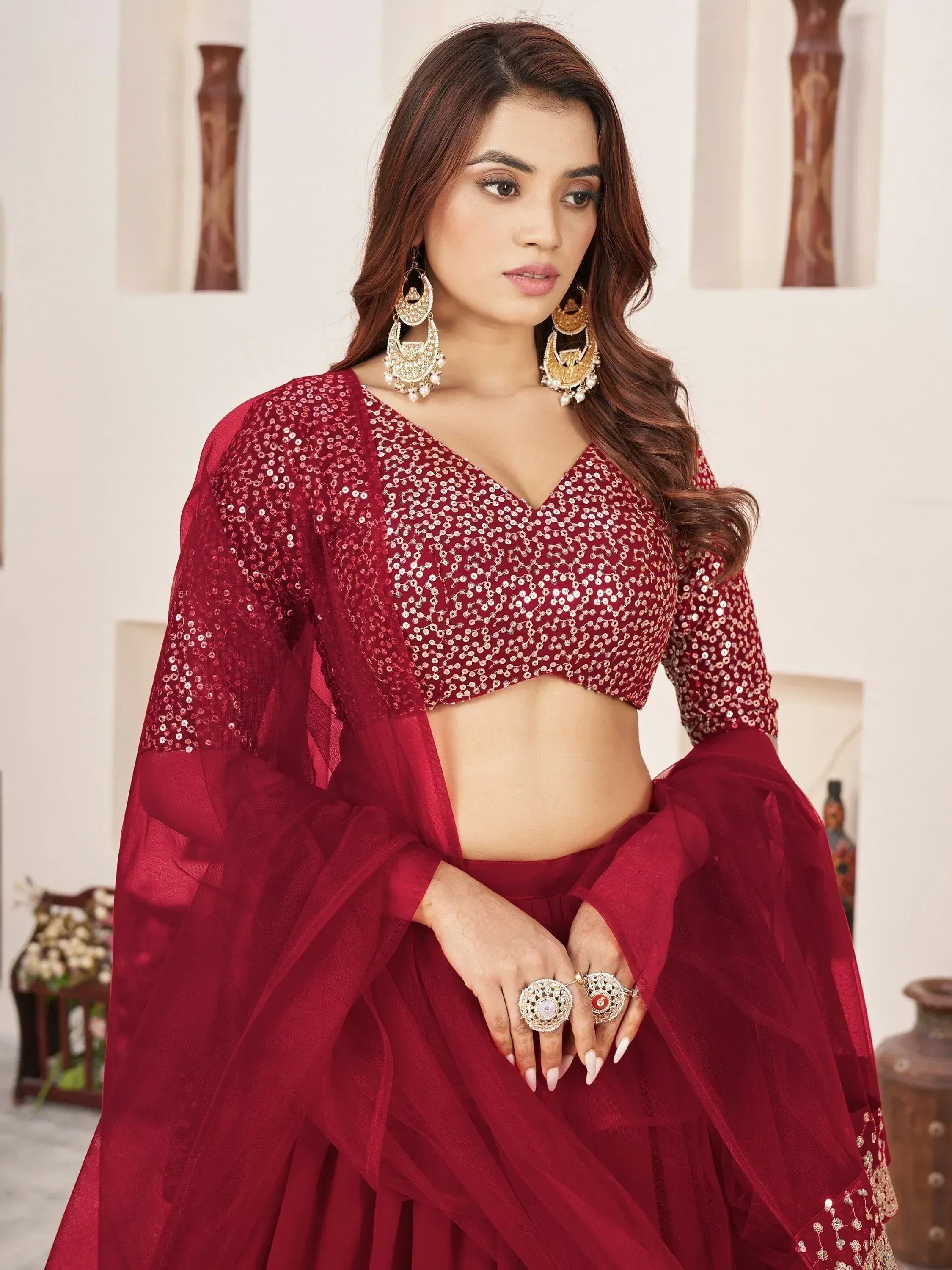 Red sequin lehenga choli with sheer sleeves, perfect for Indian ethnic wear and festive occasions
