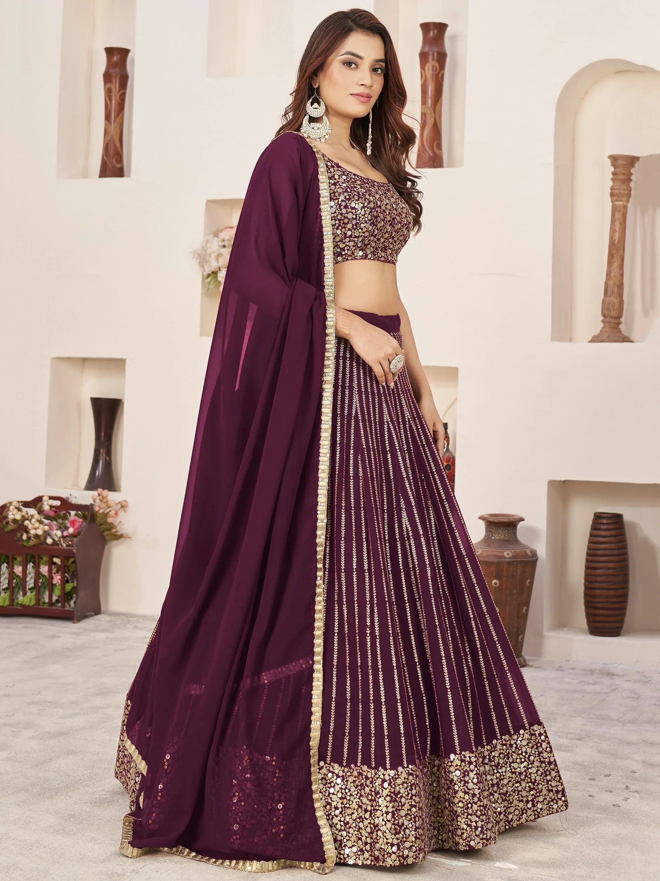 Elegant purple lehenga choli with gold embroidery, perfect for Indian ethnic wear and festive occasions.