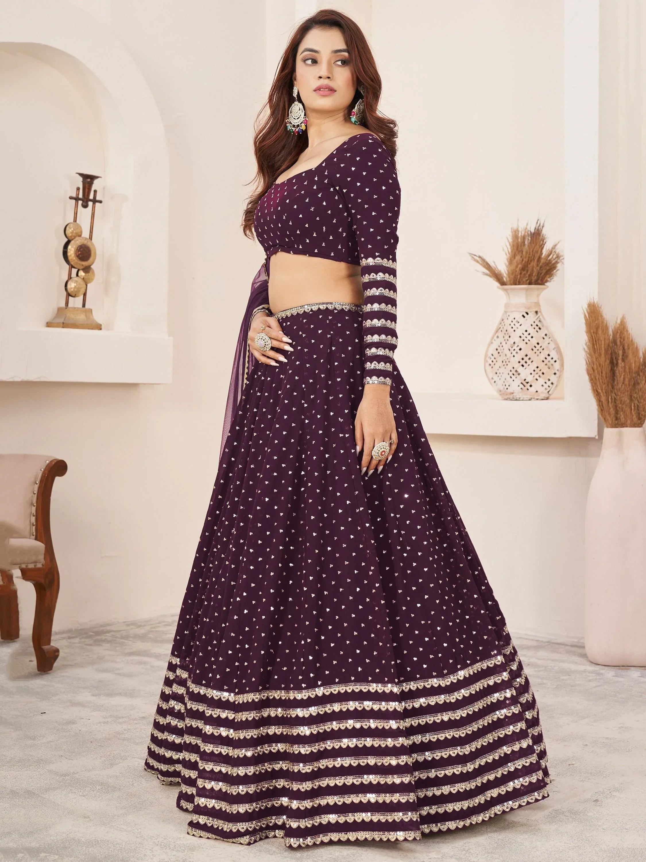 Elegant purple lehenga choli with silver embroidery, perfect for Indian weddings and festive occasions.