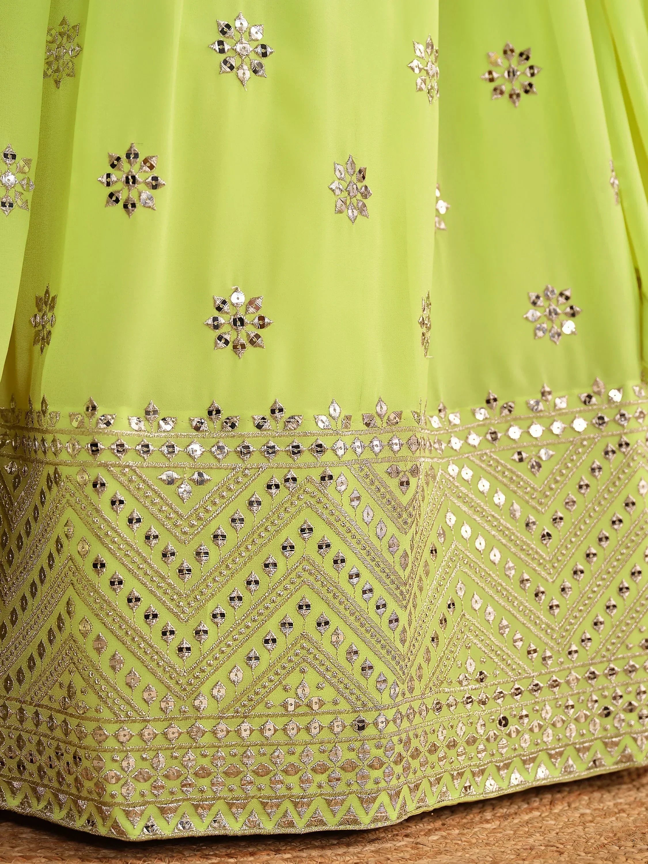 Lime green ethnic lehenga with mirror work and gold embroidery, perfect for Indian celebrations