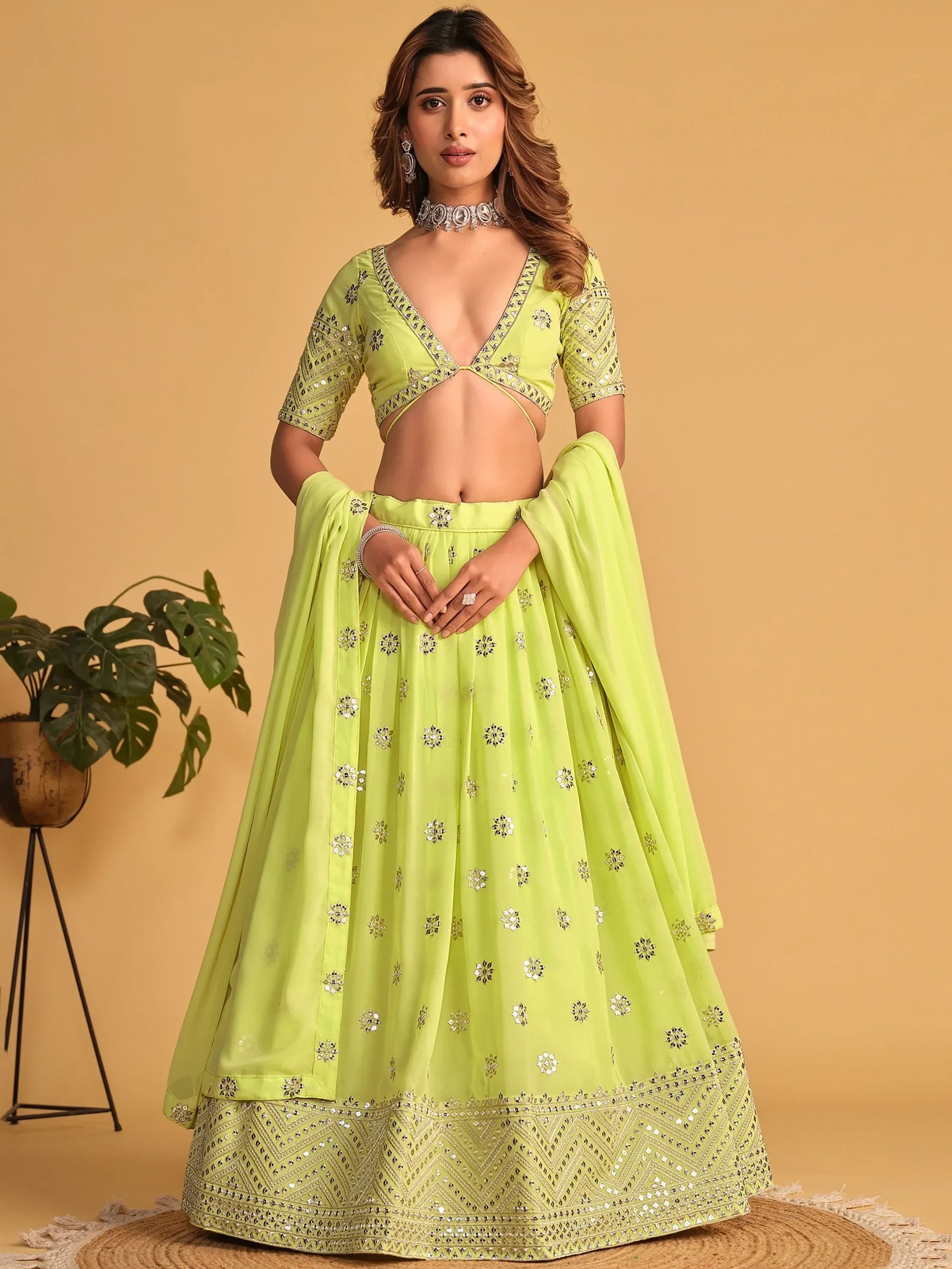 Lime green designer lehenga choli with mirror work, perfect for Indian ethnic wear occasions