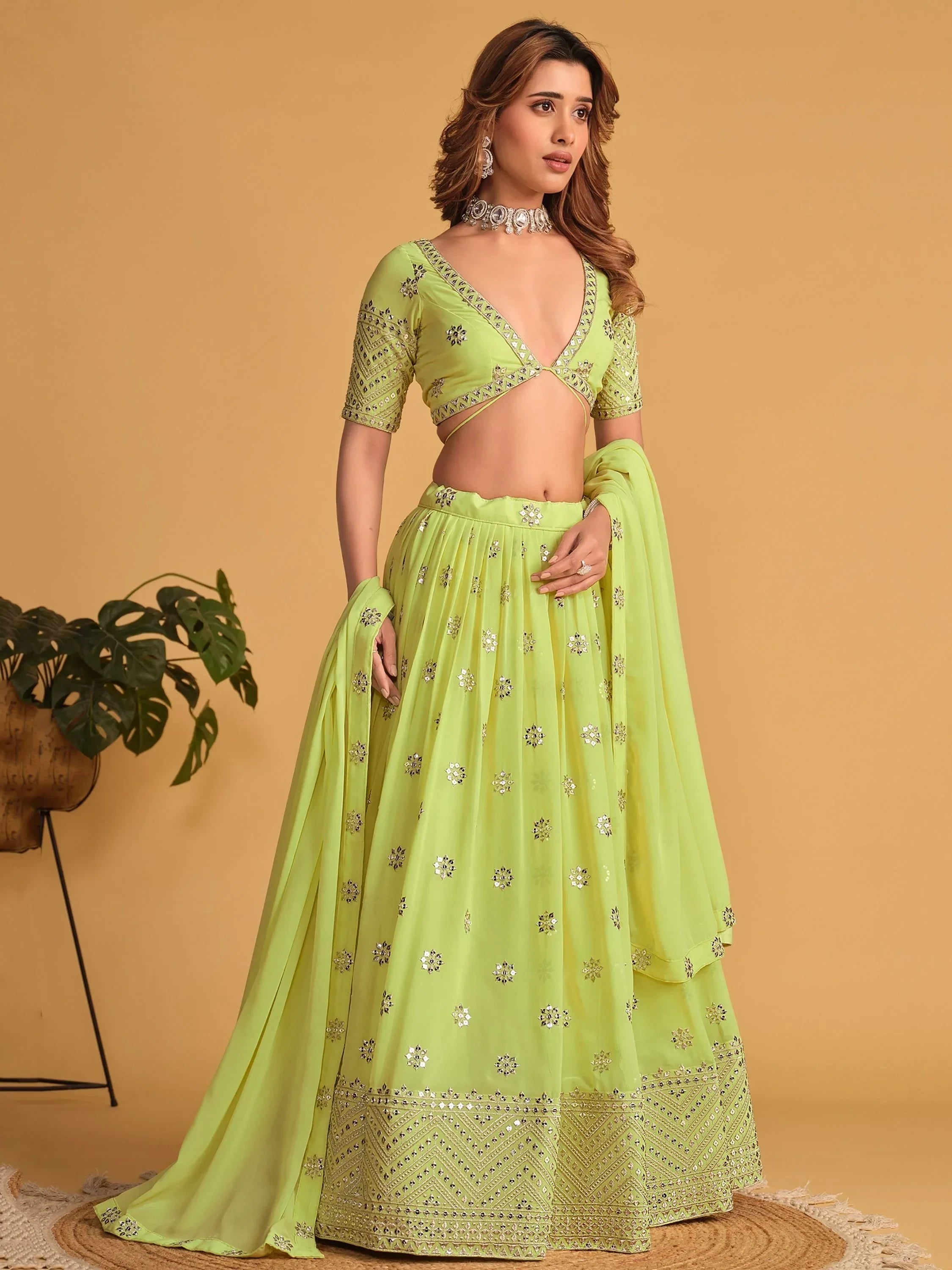 Lime green designer lehenga choli with mirror work, perfect for Indian ethnic wear events