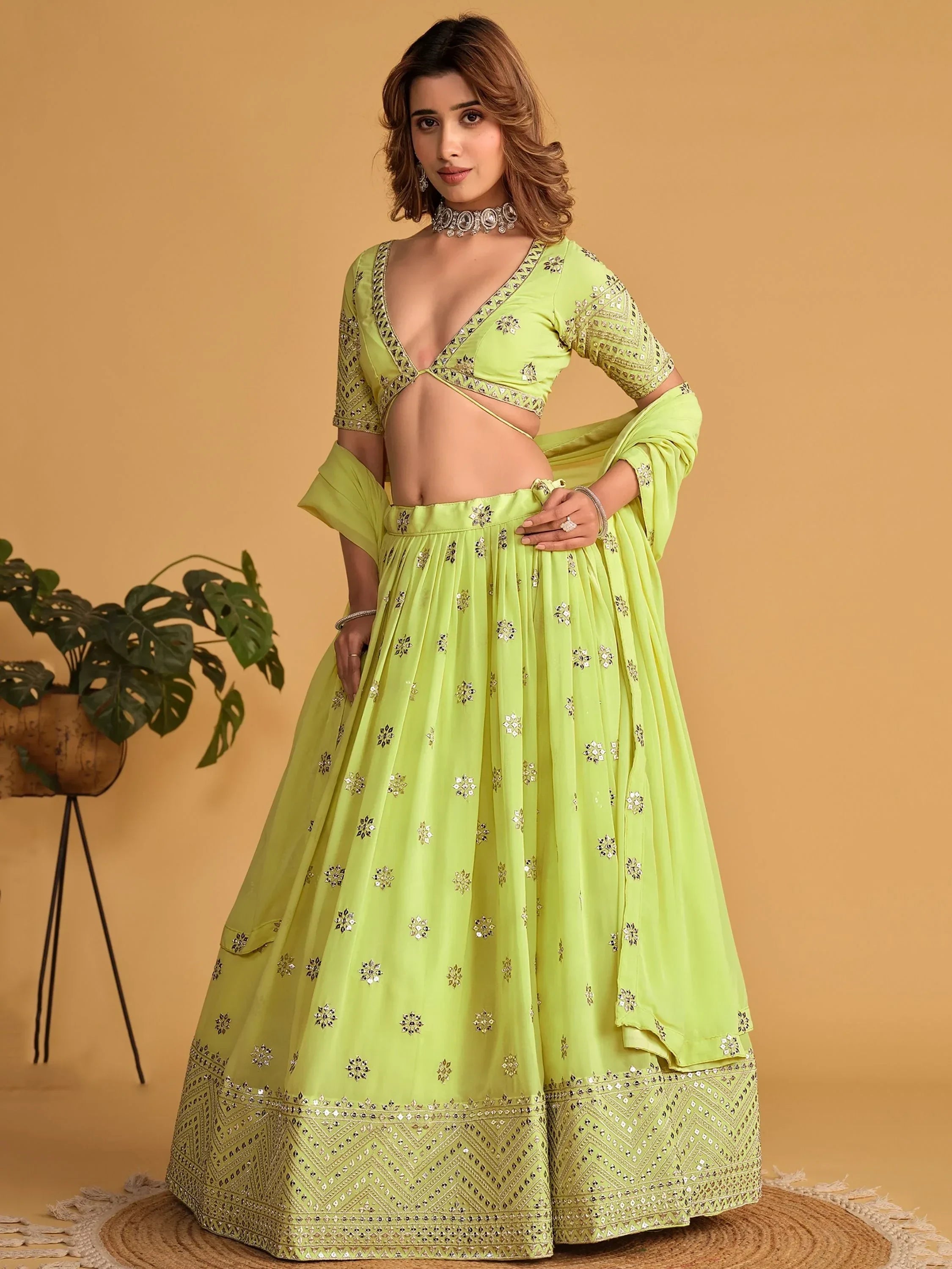 Lime green designer lehenga choli with mirror work, perfect for Indian ethnic wear events