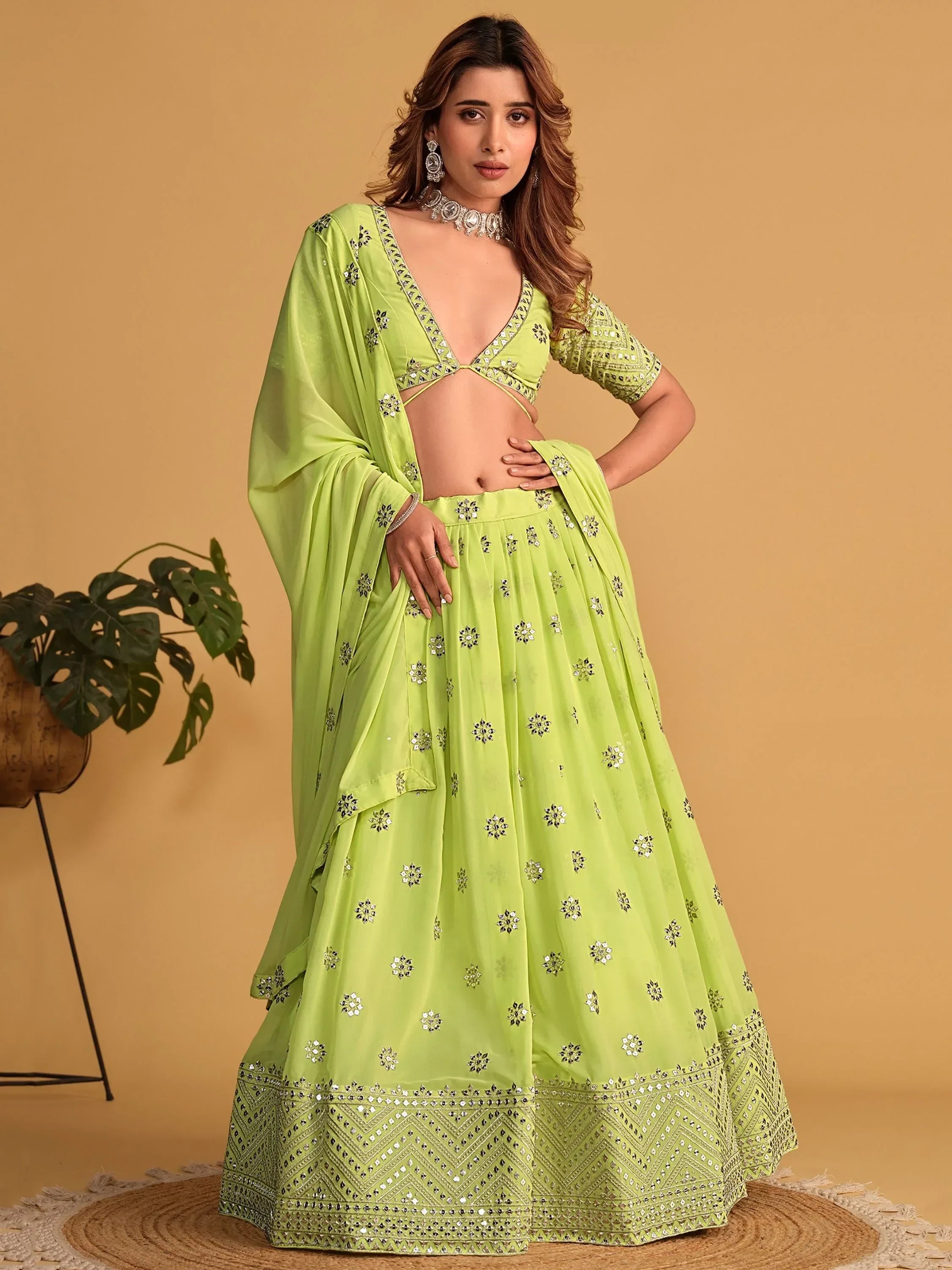 Lime green designer lehenga choli with mirror work, perfect for Indian ethnic wear events
