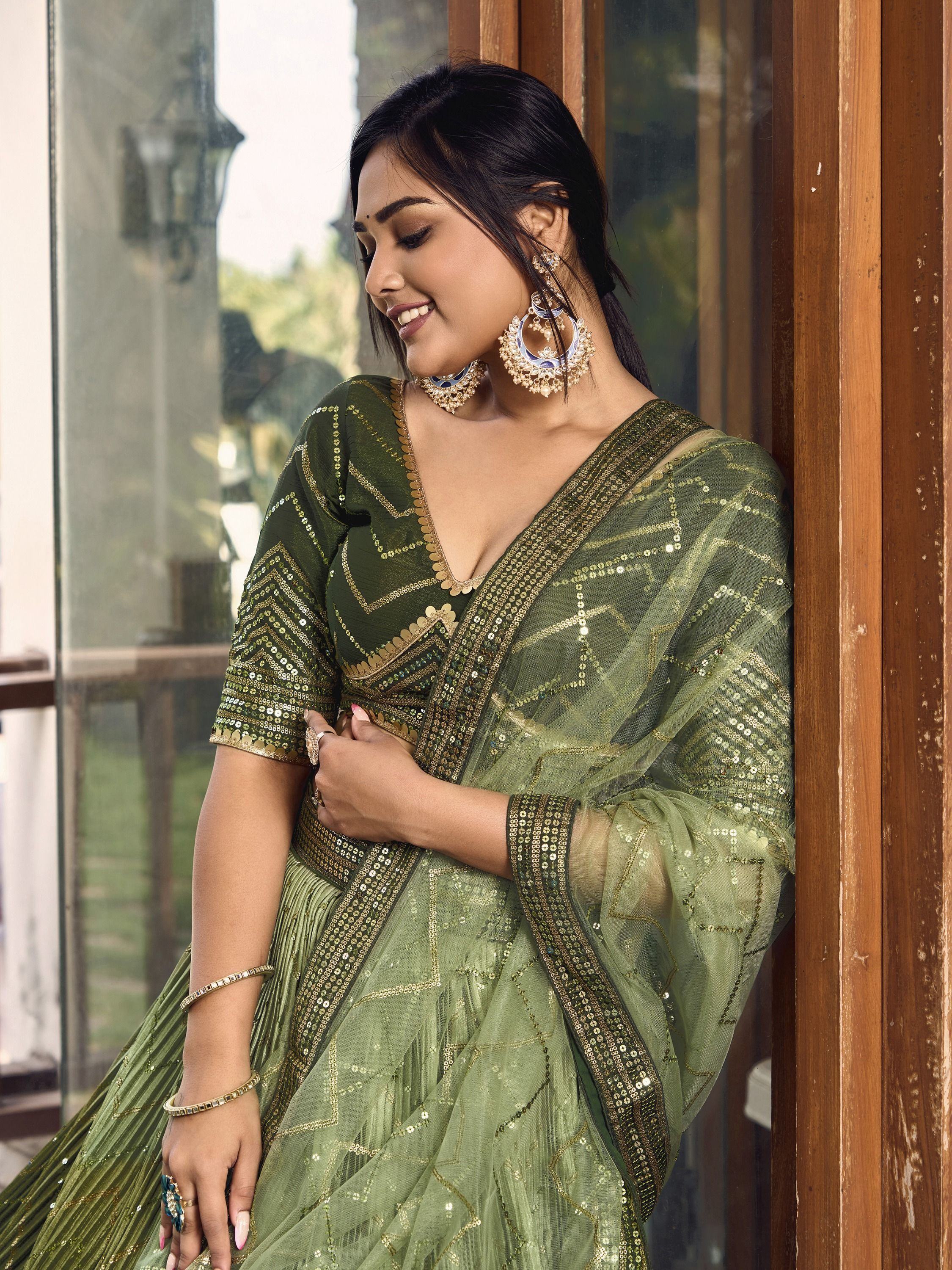 Elegant olive green designer lehenga choli with gold sequin work, perfect for Indian ethnic wear occasions.