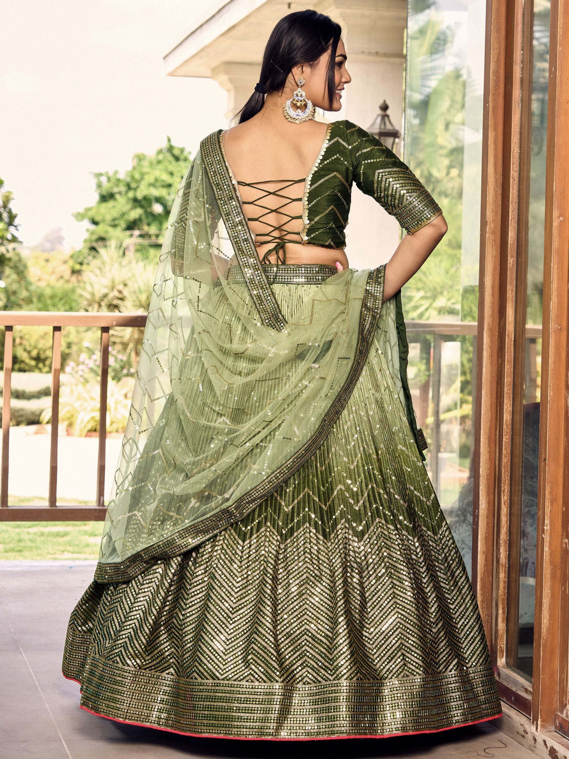 Green sequin lehenga choli with back lace-up blouse and sheer dupatta, perfect for Indian ethnic wear.