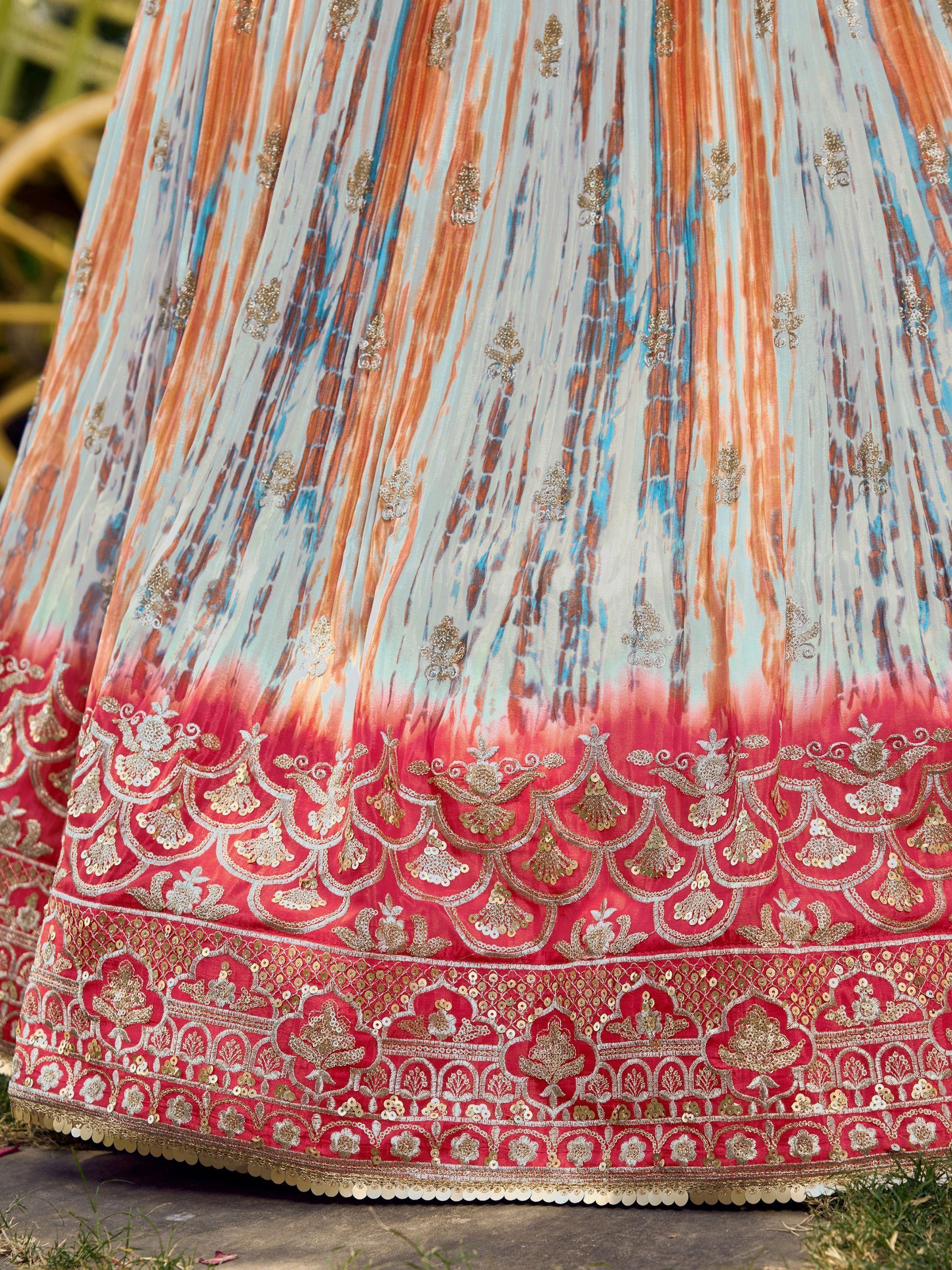 Designer lehenga with ombre print and gold embroidery, perfect for Indian ethnic wear