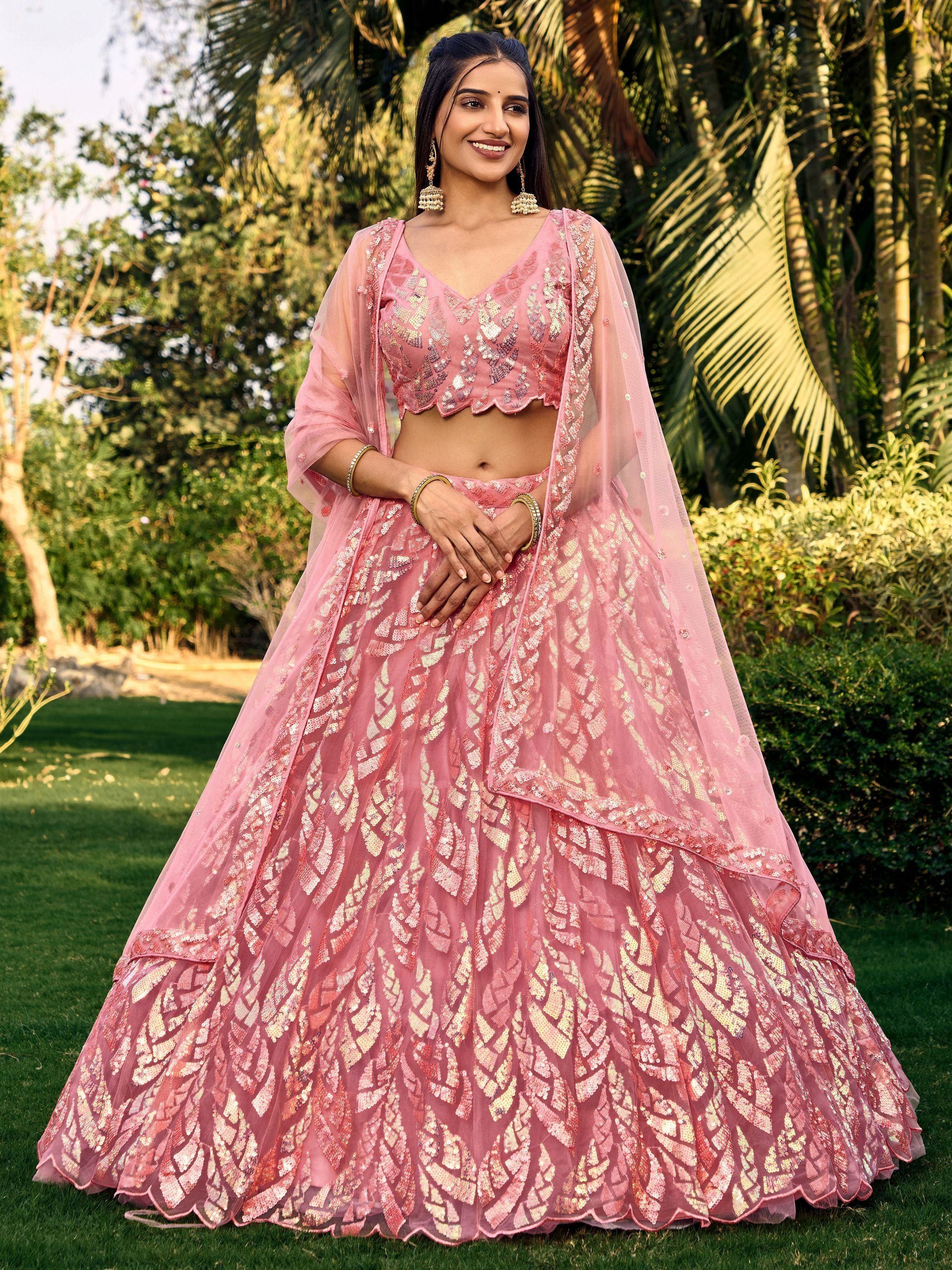 Pink sequin lehenga choli with sheer dupatta, perfect for Indian weddings and festive occasions