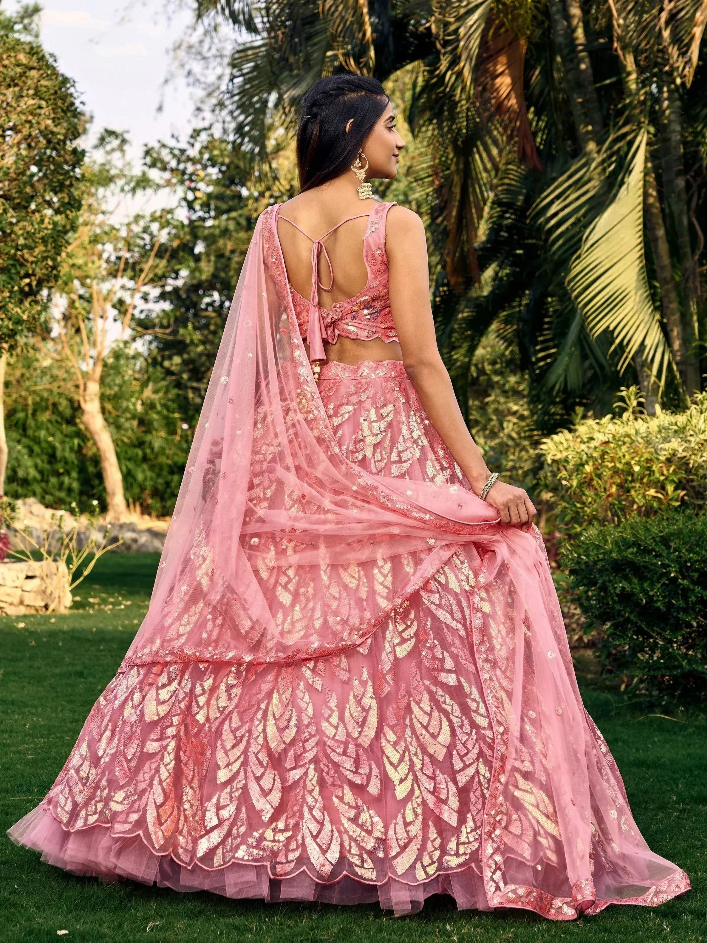 Pink sequin lehenga choli with back tie blouse, perfect for Indian weddings and festive occasions