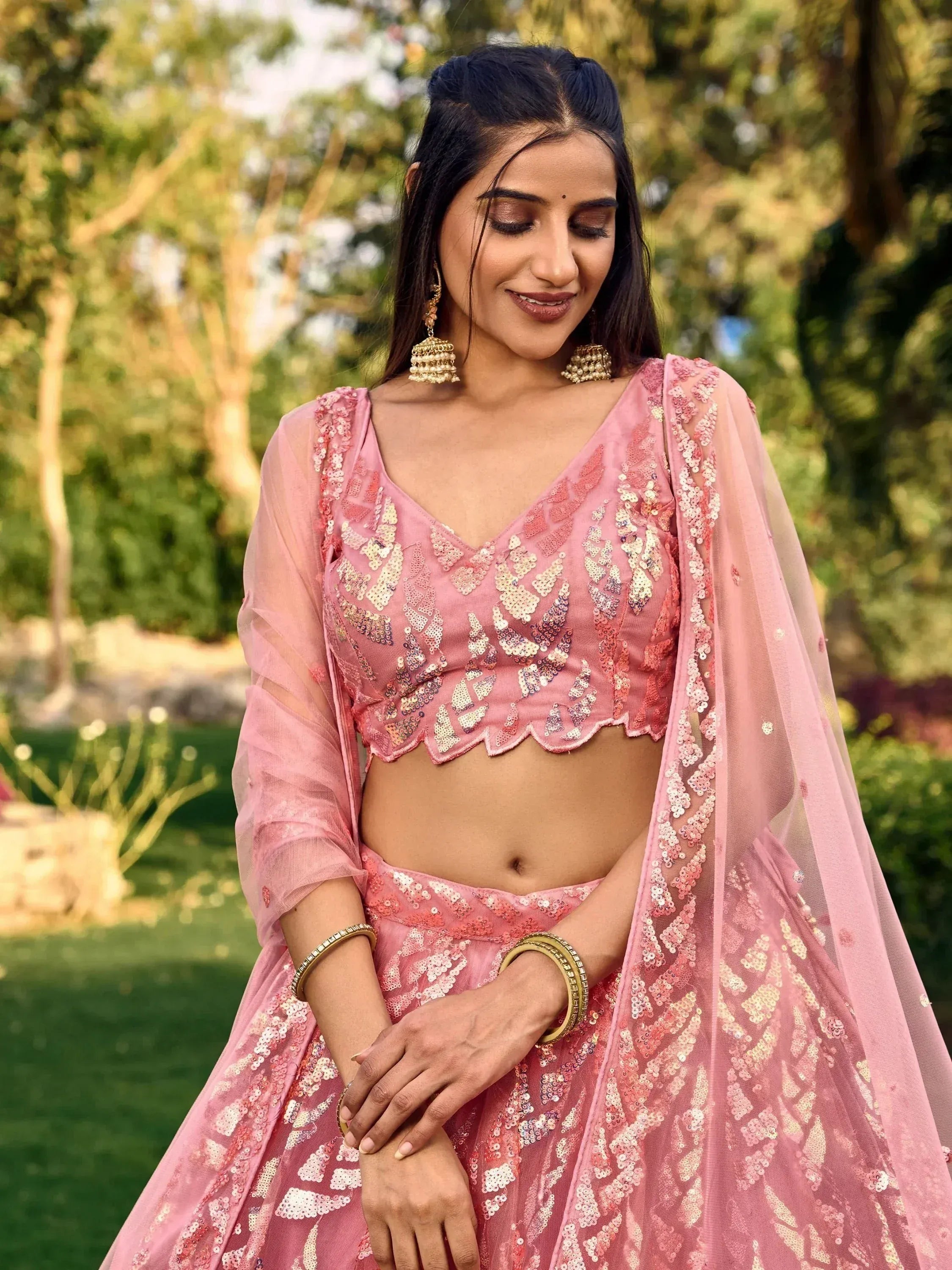 Pink sequin lehenga choli with sheer dupatta, perfect for Indian ethnic wear and festive occasions