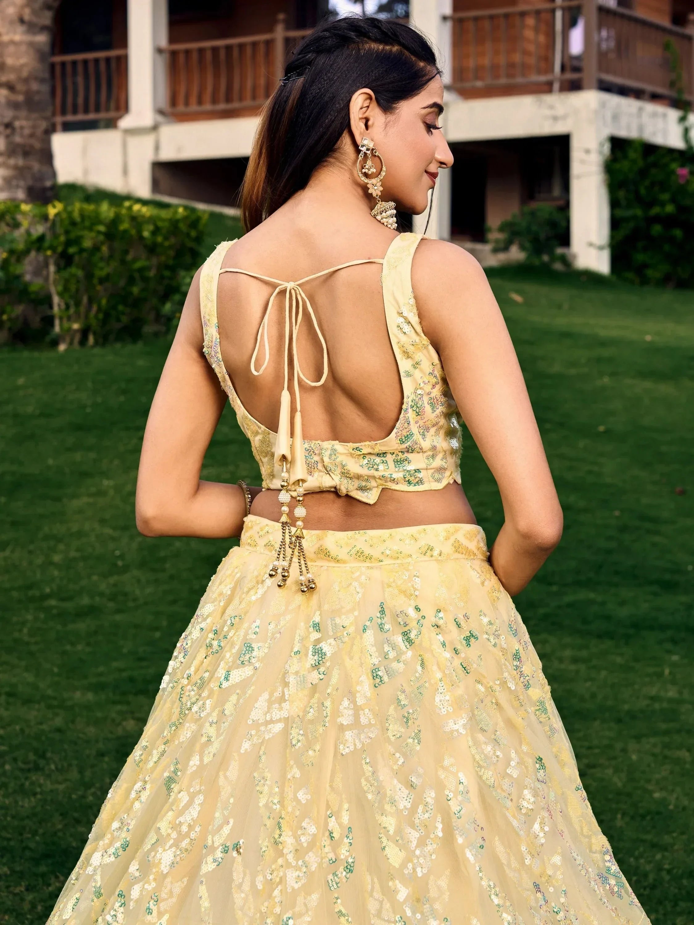 Yellow sequin lehenga choli with back tie design, perfect for Indian ethnic occasions