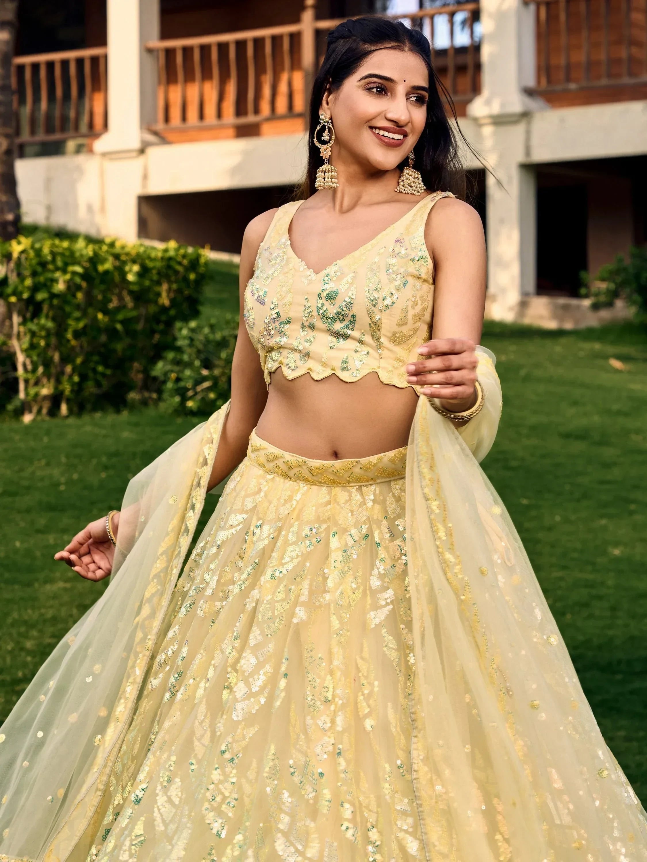 Yellow sequin lehenga choli with scalloped blouse, perfect for Indian ethnic events and weddings
