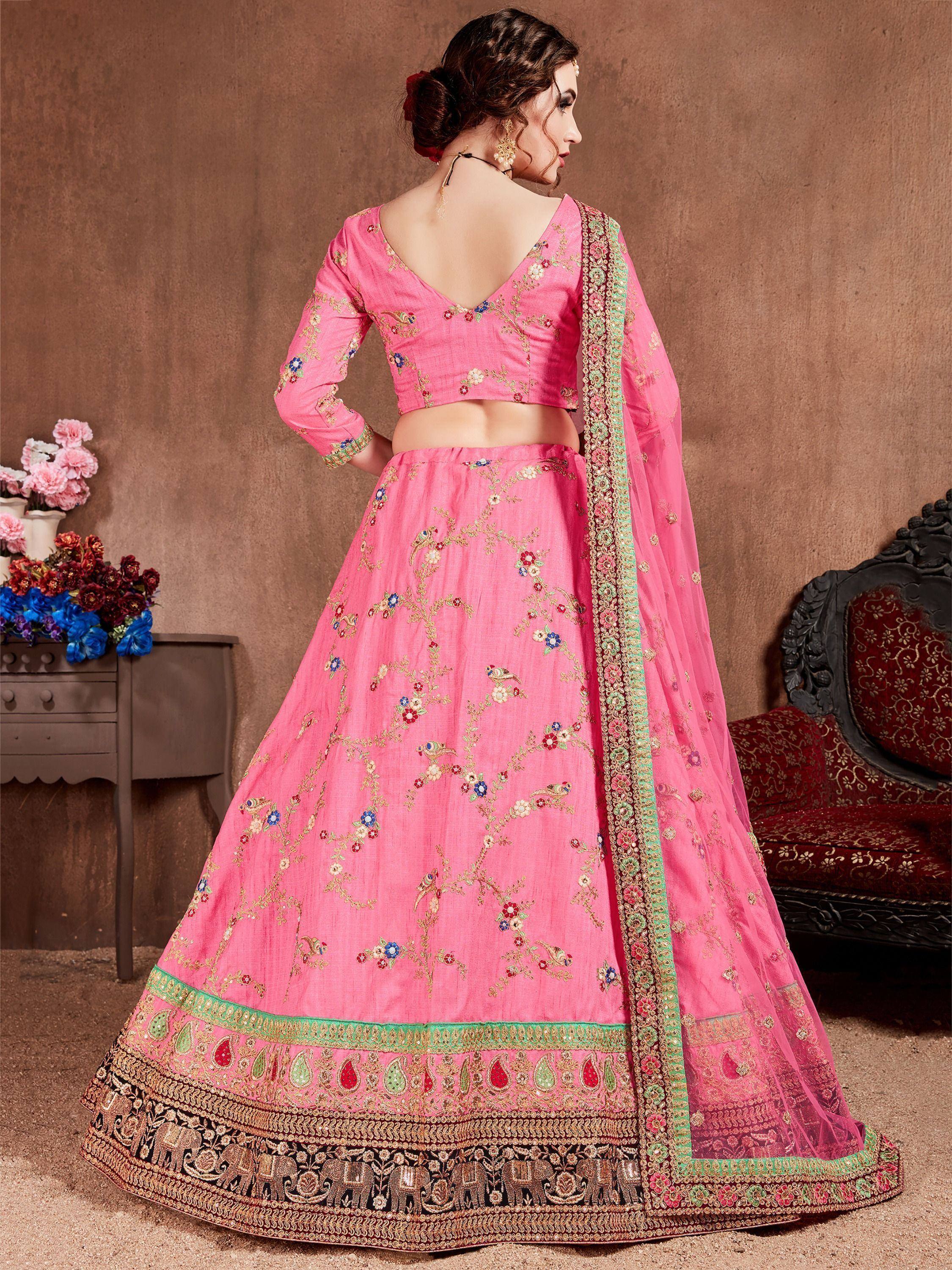 Pink embroidered lehenga choli with floral and bird motifs, perfect for Indian ethnic wear occasions
