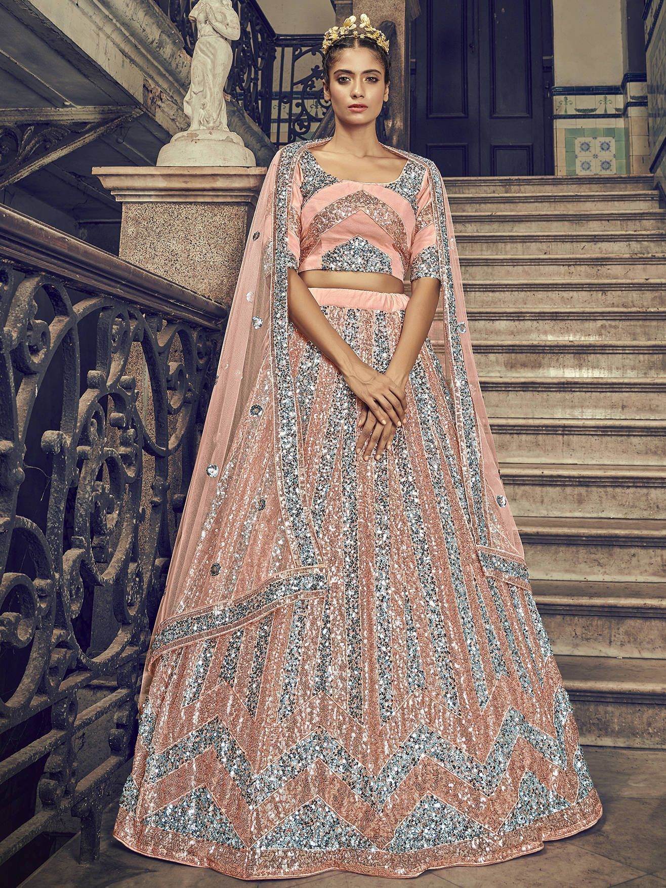 Peach Sequins Embroidered Net Party Wear Lehenga Choli