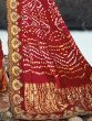 Mesmerizing Maroon Bandhani Printed Satin Wedding Wear Saree 
