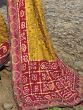 Beautiful Yellow Bandhani Printed Satin Wedding Wear Saree With Blouse
