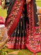 Alluring Black Patola Printed Silk Traditional Saree With Blouse
