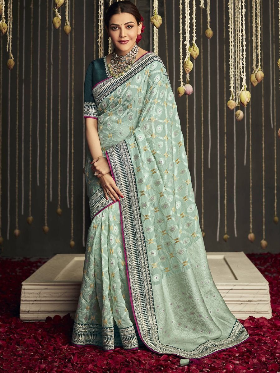 Wonderful Creamy Green Fancy Silk Embroidered Wedding Wear Saree