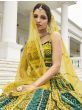 Alluring Yellow And Green Bandhani Printed Silk Lehenga Choli

