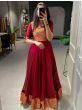 Alluring Maroon Zari Weaved Silk Festive Wear Gown