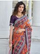 Sumptuous Purple And Orange Patola Weaving Silk Reception Wear Saree