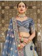 Prominent Sky Blue Embroidery Velvet Wedding Wear Lehenga Choli