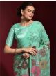 Gleaming Sea Green Georgette Zari Border Party Wear Saree With Blouse